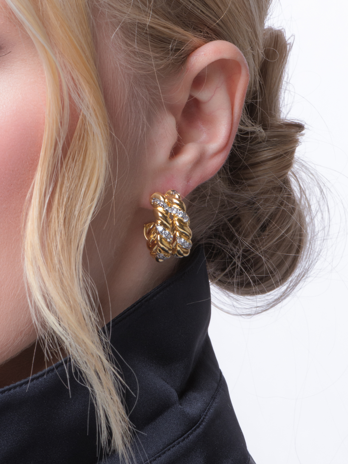 Close-up of a woman wearing Kinsey Designs' Benny Double Hoops—her hair in a low bun, paired with a black high-collar top.