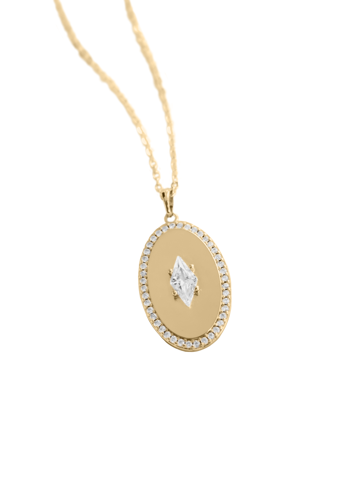 The Fique Necklace by Kinsey Designs features a gold-plated oval cubic zirconia pendant with a central marquise gem and a border of small stones, elegantly displayed on a 32-inch chain.