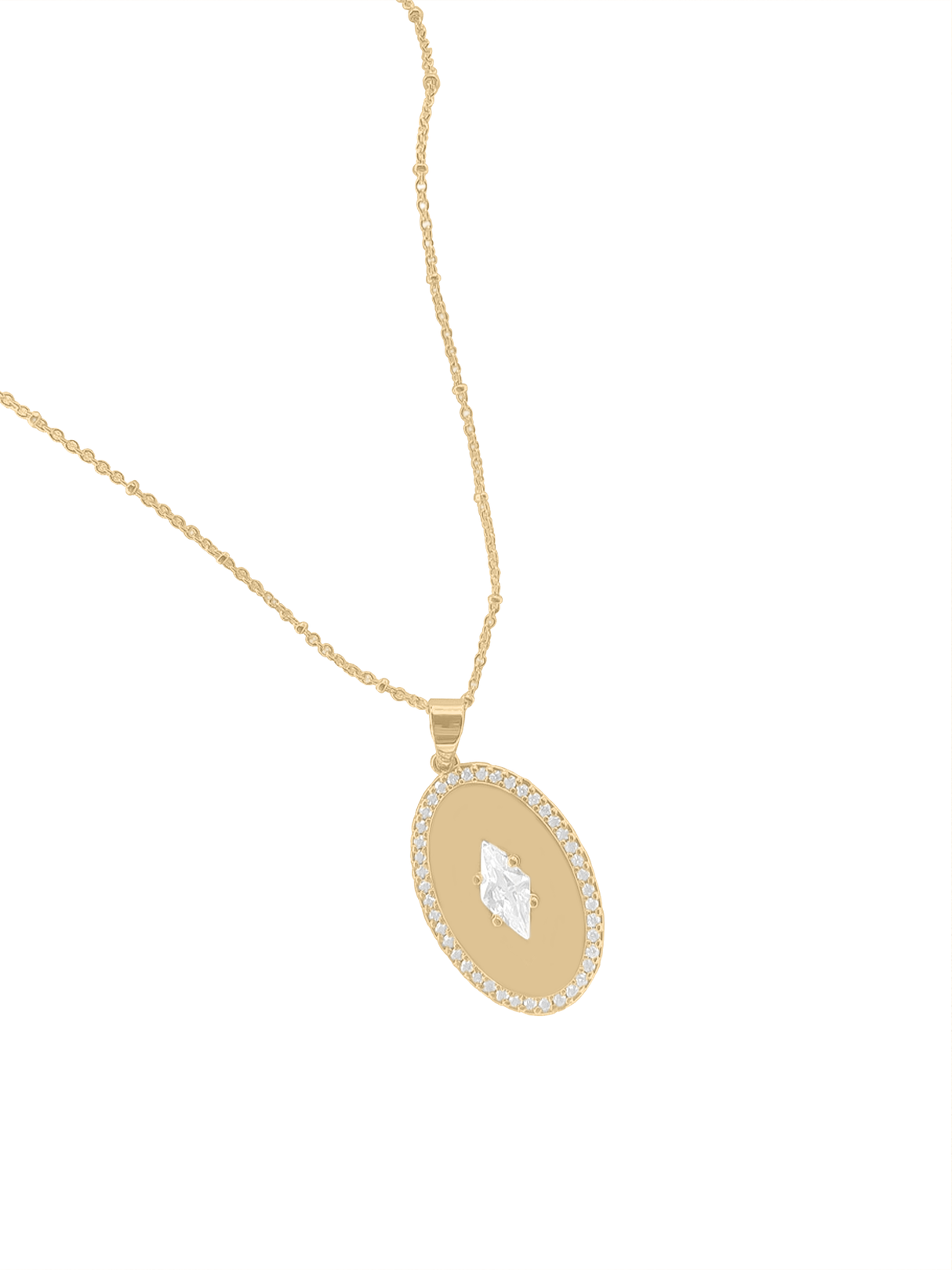 The Fique Necklace - Short by Kinsey Designs features a gold-plated chain and an oval cubic zirconia pendant with a diamond center and sparkling border—ideal sample sale jewelry shown on a white background.