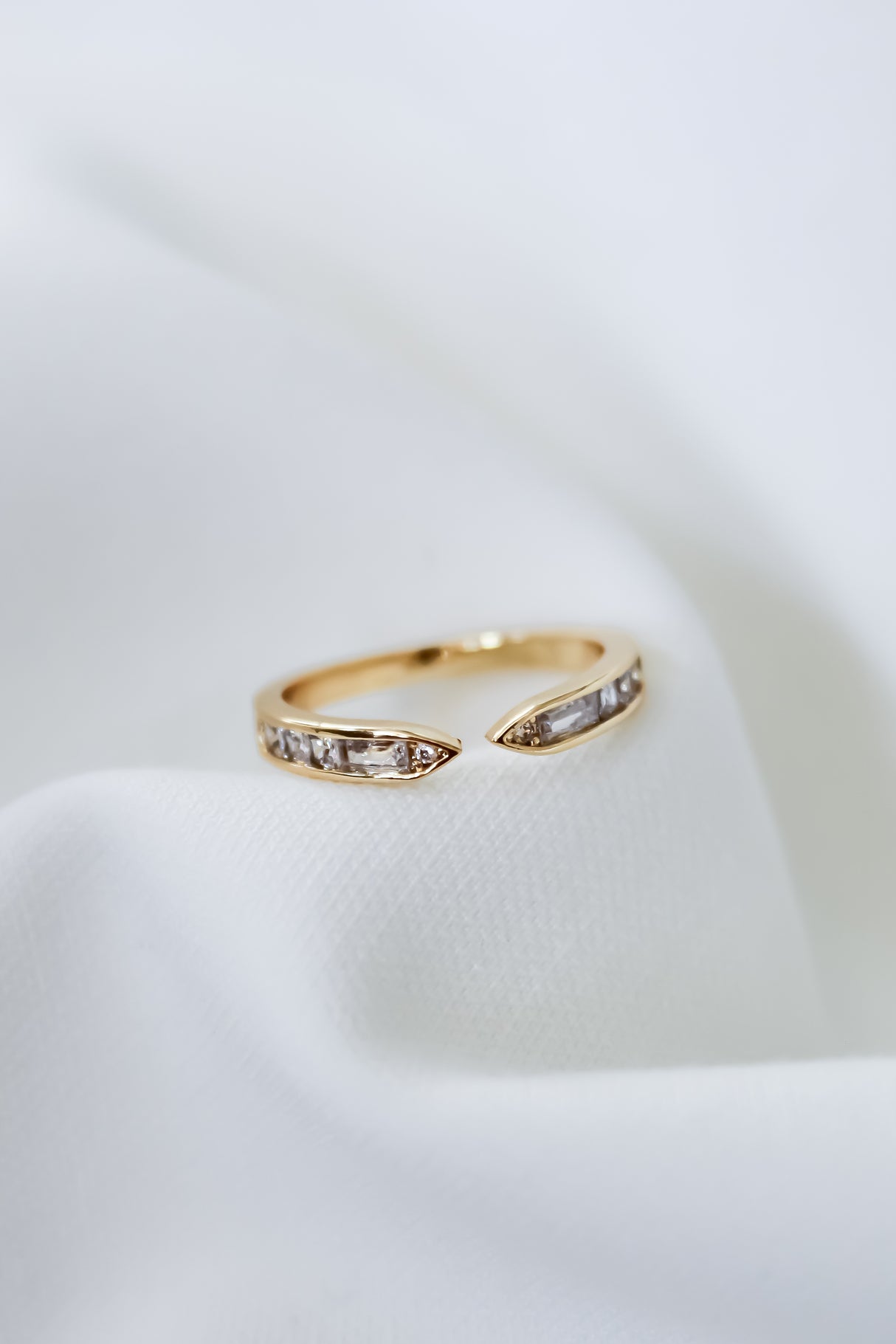 The Kinsey Designs Hayden Ring is a gold filled band with embedded rectangular stones, offering an elegant baguette CZ style perfect for any occasion.