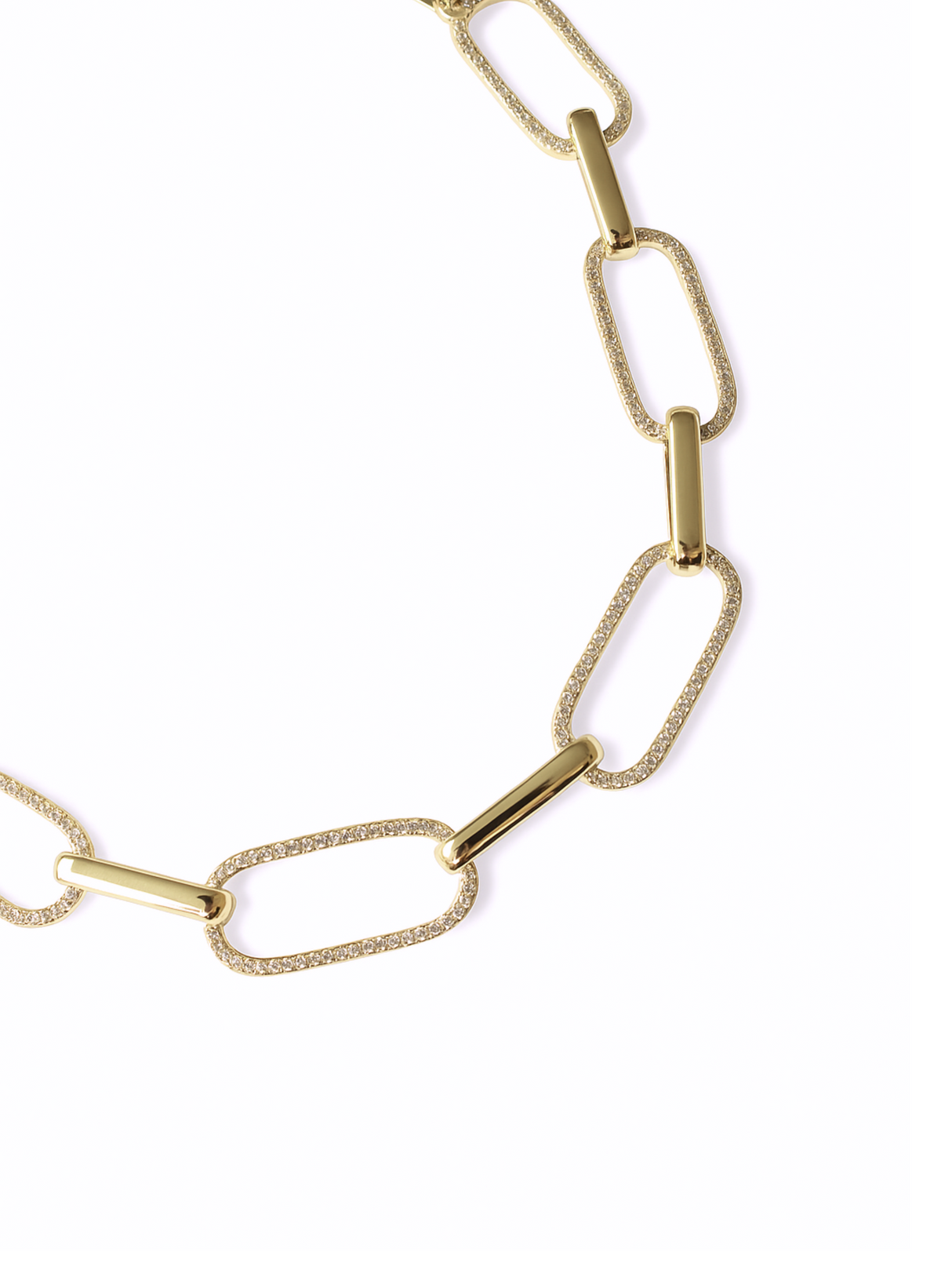 The Jameson Necklace by Kinsey Designs features alternating textured and smooth rectangular gold links, creating a striking statement piece.