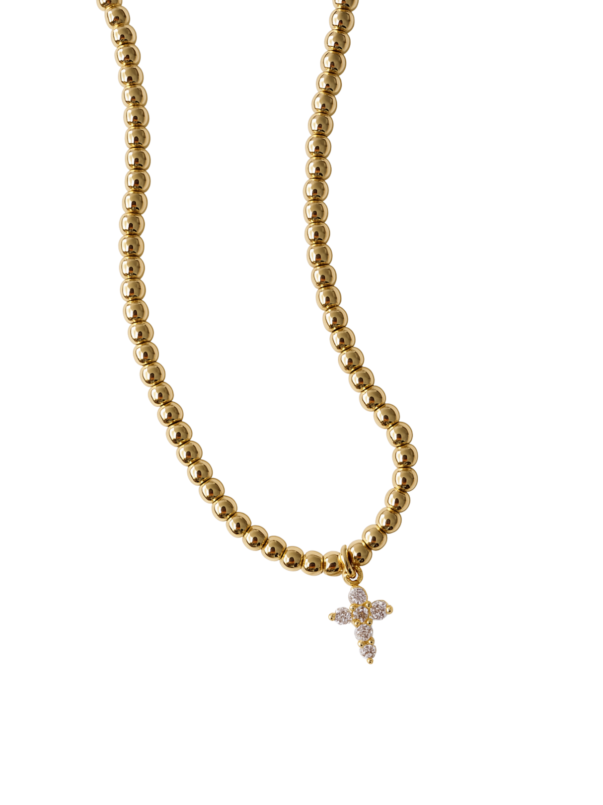 The Selena Necklace by Kinsey Designs features 3mm gold beads and a small diamond-studded cross pendant, secured with a clasp and extender, all displayed on a white background.