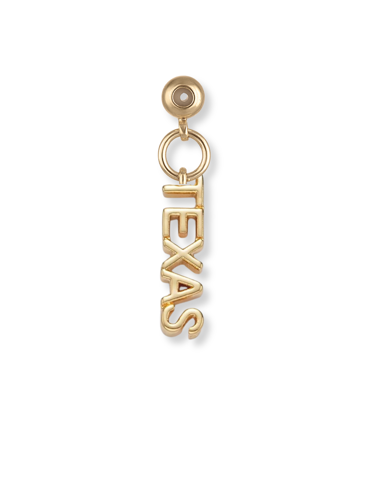 The Texas Grip Charm by Kinsey Designs is a gold-colored earring featuring "TEXAS" hanging vertically from a circular stud—a bold, eye-catching piece for Texas jewelry lovers.