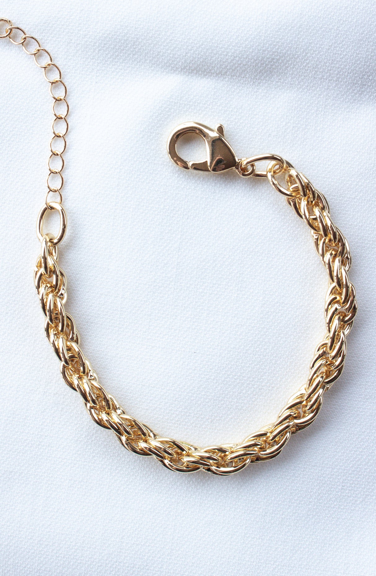 The Kinsey Designs Yacht Bracelet features a gold filled chain, lobster clasp, and 6.5" length. Shown on white fabric—available now at our sample sale.