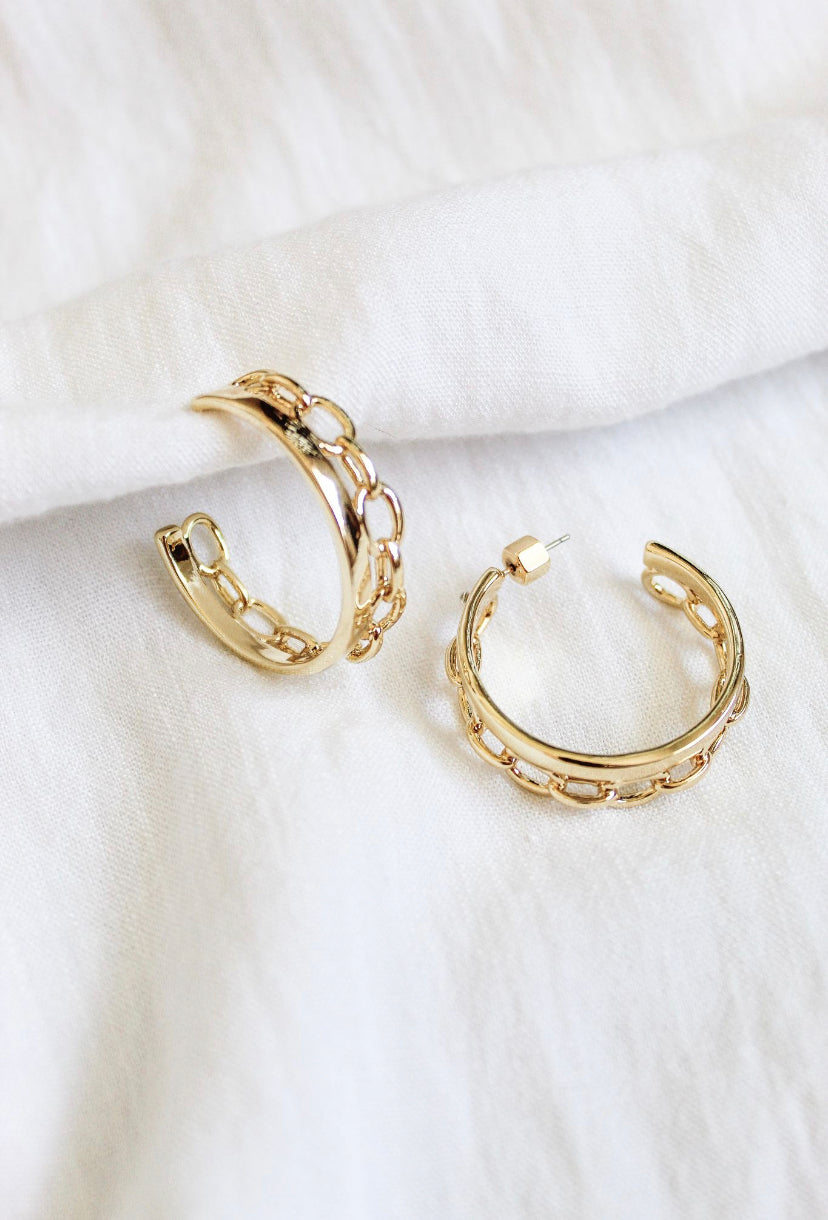 Two Beck Hoop earrings by Kinsey Designs, featuring 14k gold plating and a chain-link design, displayed on a white fabric background. Final Sale.