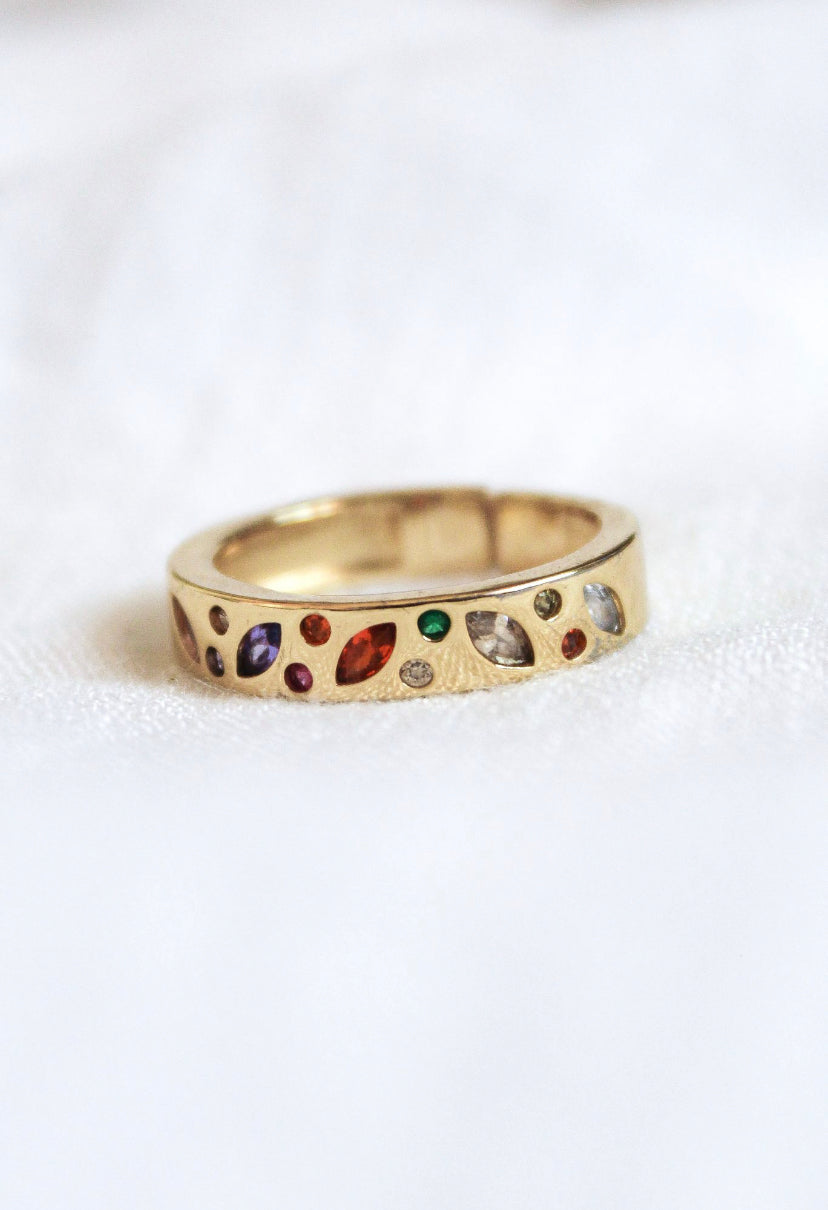 The Luna Ring - Multi by Kinsey Designs Archives features colorful gemstones in an irregular gold-plated setting. Displayed on a white background, it's available in size 7—perfect for adding a vibrant touch to your style.