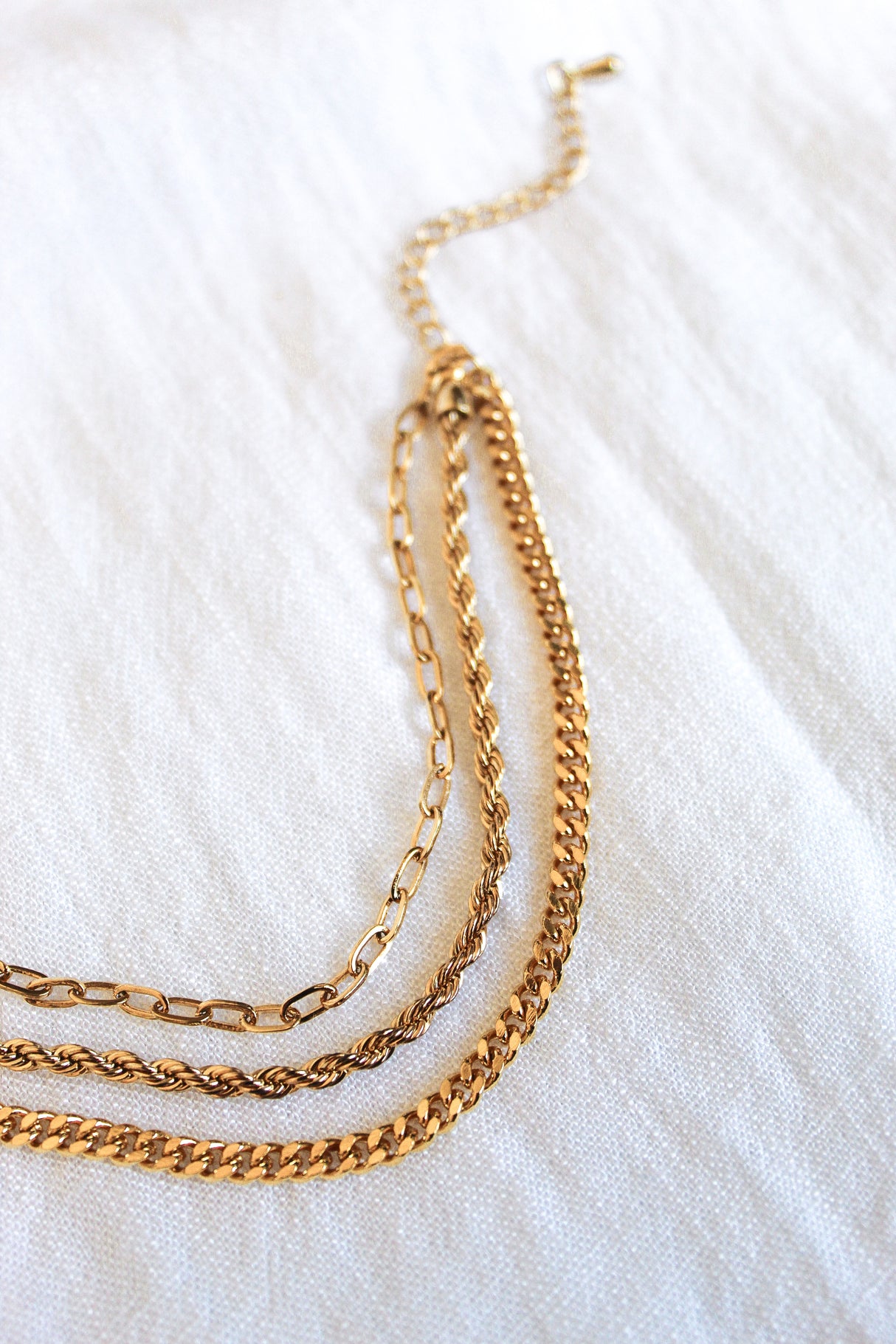 The Emmy Bracelet by Kinsey Designs Archives is displayed on a white fabric background.