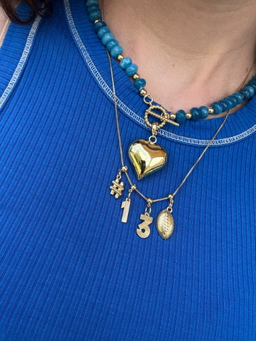 Sport’s Day Glam: Stylish Charms to Celebrate Your Team Spirit