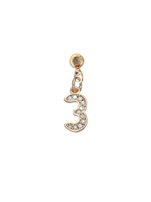 The Kinsey Designs Numerical Grip Charm is a gold charm shaped like the number 3, encrusted with small clear rhinestones—perfect for adding to your charm bar necklace.