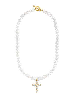 The Bellena Pearl Cross Necklace by Kinsey Designs features a crystal-studded cross pendant and gold toggle clasp, perfect for baptism jewelry. Shown on a white background for an elegant, timeless look.