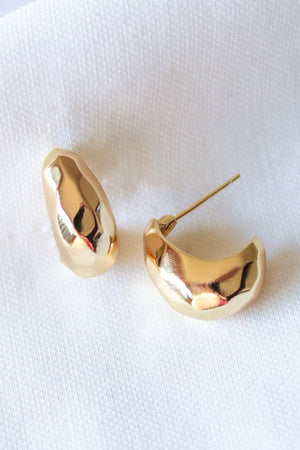 The Eden Hoop by Kinsey Designs Archives features gold filled chunky hoops with a hammered texture, .75" wide, shown on a white fabric background.
