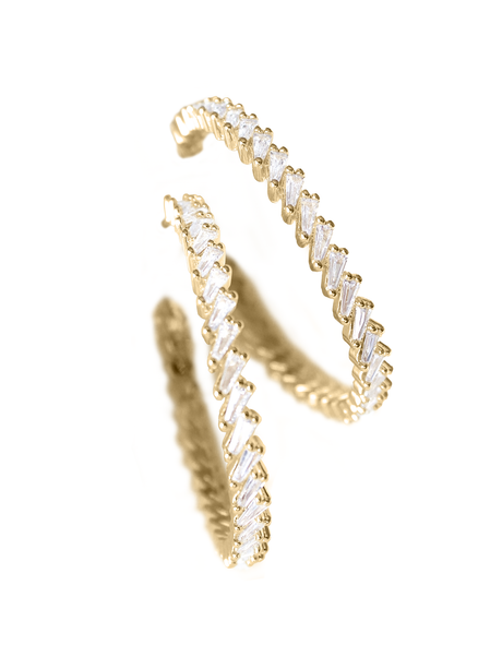 The Graze Hoop earrings by Kinsey Designs Archives feature gold-filled hoops with zig-zag patterns and clear baguette-cut cubic zirconia, displayed against a white background.