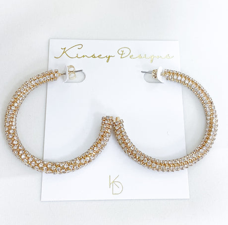 Large Marlowe Hoop earrings by Kinsey Designs Archives, featuring sparkling rhinestones, displayed on a white card.