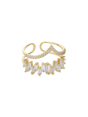 The Ines Ring by Kinsey Designs features two gold-plated bands adorned with small round and rectangular cubic zirconia gemstones, shown on a white background.