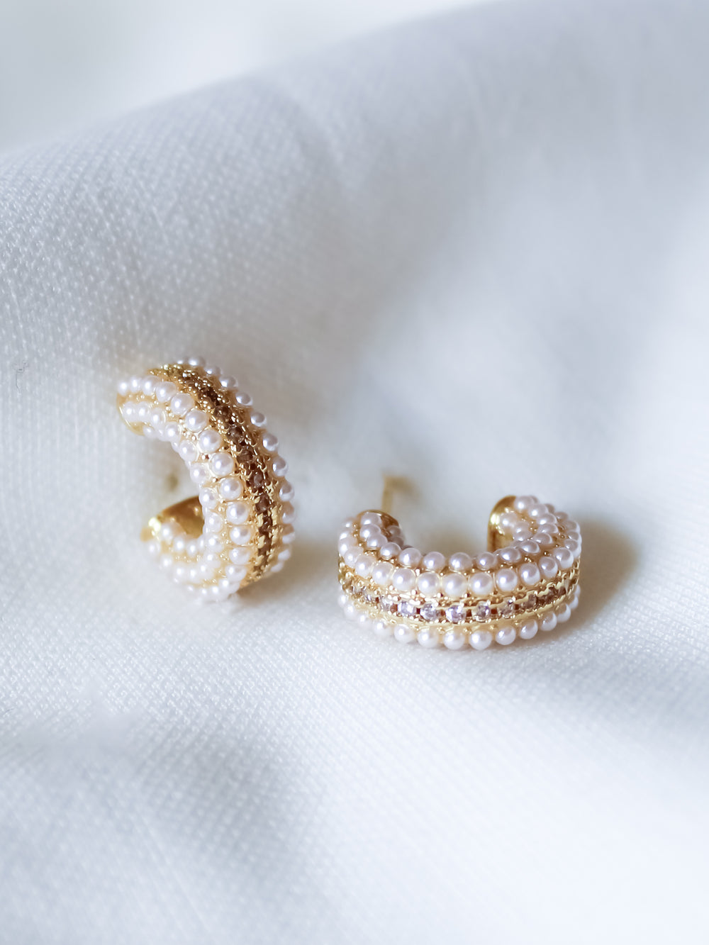 The Korey Pearl Hoops by Kinsey Designs feature lustrous pearls set on elegant gold-filled hoops for a classic look.