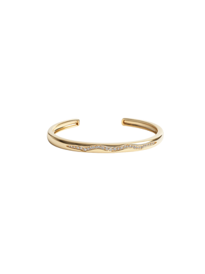 The Lily Baby Cuff by Kinsey Designs is a gold filled bracelet with a subtle wave design and small sparkling cubic zirconia stones on the front, displayed against a white background.