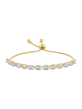 The Lowen Adjustable Bracelet by Kinsey Designs features oval-shaped clear gemstones in a single row, set on a gold adjustable chain.