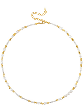 The Louie Pearl Necklace by Kinsey Designs features a gold-filled chain adorned with small white pearls, gold beads, and an adjustable clasp.