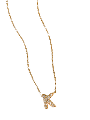The LUX Slide Initial Necklace Letter K by Kinsey Designs Collection features a sparkling diamond-studded "K" pendant on a gold chain, shown against a plain white background.