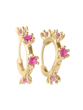 The Mae Huggie by Kinsey Designs Archives features small gold filled hoops, each adorned with four evenly spaced bright pink cubic zirconia gemstones.