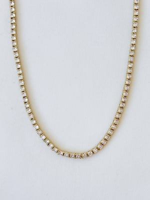 The Malia Tennis Necklace by Kinsey Designs Archives features round diamonds and a 15" gold filled chain, shown on a white background. Don’t miss your chance to own this classic piece at our exclusive sample sale.