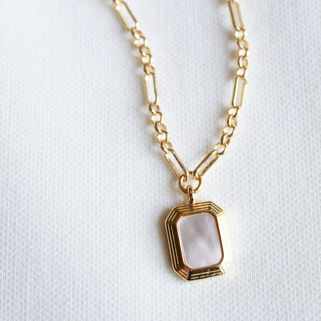 The Mirabelle Pendant Necklace by Kinsey Designs Archives features a rectangular mother-of-pearl pendant on a classic 20" gold filled chain, displayed against a white textured background.