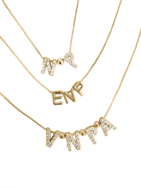 The Kinsey Designs Nurse Charm Necklace collection features three gold filled letter pendant necklaces—"MP," "ENP," and "VNPA"—some with rhinestone accents. Show your credentials in style with these elegant profession necklaces.