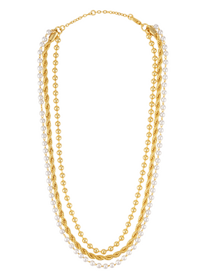 The Kinsey Designs Olivia Layer Necklace is artfully displayed with delicate pearl pieces, creating a stunning gold and pearl ensemble against a white backdrop.