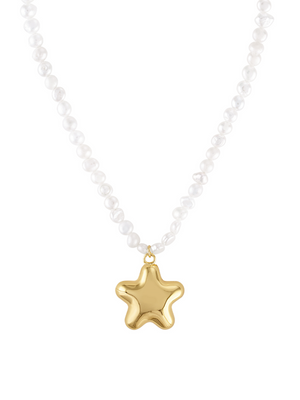 The Paulette Puffy Star Necklace by Kinsey Designs features a shiny gold star pendant suspended at the center.