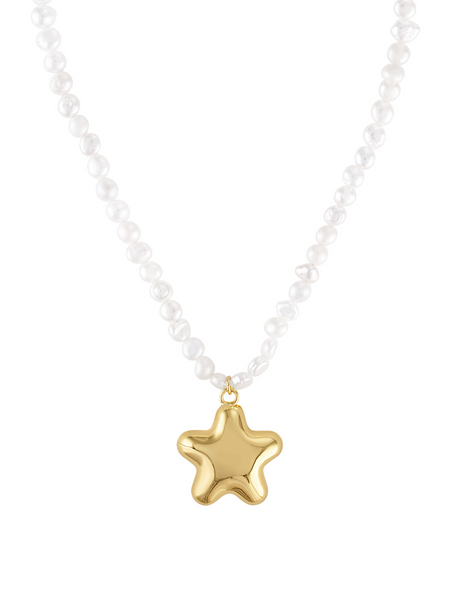 The Paulette Puffy Star Necklace by Kinsey Designs features a shiny gold star pendant suspended at the center.