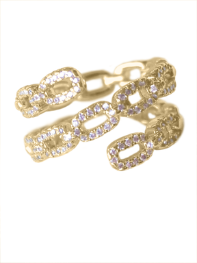 The Peyton Lux Ring by Kinsey Designs Archives features a modern gold chunky oval chain-link design, encrusted with small clear gemstones and displayed on a white background.
