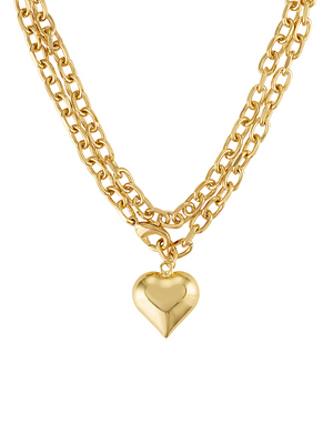 The Kinsey Designs Poppy Puffy Heart Necklace features a gold double chain with oval links and a puffy heart-shaped pendant, shown on a white background.