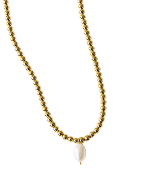 The Reed Necklace by Kinsey Designs features a single oval pearl pendant on a gold filled chain, creating an elegant look.