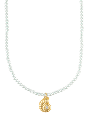 The Tilly Nautilus Necklace by Kinsey Designs features a delicate gold seashell pendant with a tiny clear CZ stone at the center, inspired by classic pearl necklaces.