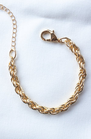 The Kinsey Designs Yacht Bracelet features a gold filled chain, lobster clasp, and 6.5" length. Shown on white fabric—available now at our sample sale.