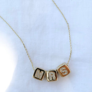 The MRS Block Necklace by Kinsey Designs features three square letter pendants spelling "MRS"—a perfect bride-to-be gift.
