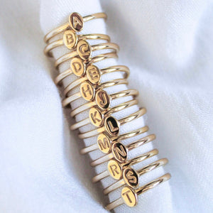 Kinsey Designs Collection's Kinsey Initial Ring Letter C shown stacked on a white fabric background.