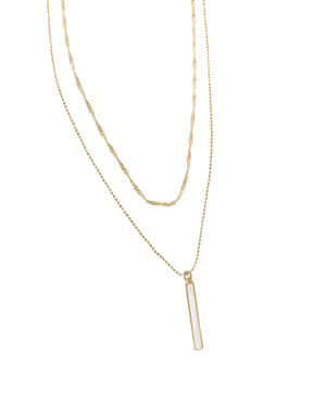 The Kalani Pearl Necklace by Kinsey Designs Archives pairs a twisted gold chain with a vertical rectangular mother-of-pearl pendant, creating a refined, delicate accent.