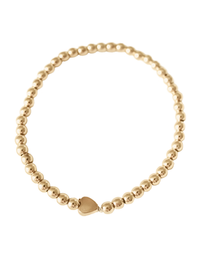 The Kinsey Designs Liam Heart Bracelet features gold-filled beads and a heart charm at the center, shown in a circle on white. Its adjustable stretch design offers comfort—a great choice from our Sample Sale.