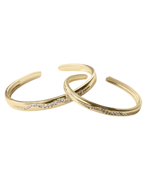 The Kinsey Designs Lily Mama & Baby Cuff Set features two gold filled bracelets with a wavy design, each accented by a row of sparkling cubic zirconia stones.