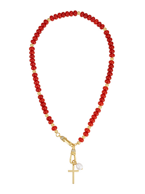 The Katherine Cross Gemstone Necklace by Kinsey Designs features red carnelian beads, gold accents, a cross pendant, and a white pearl charm for a unique statement look.