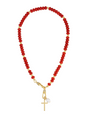 The Katherine Cross Gemstone Necklace by Kinsey Designs features red carnelian beads, gold accents, a cross pendant, and a white pearl charm for a unique statement look.
