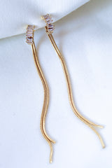 The Callie Earring by Kinsey Designs Archives features 3.5-inch gold filled earrings with rectangular cubic zirconia accents, shown on a white fabric background.