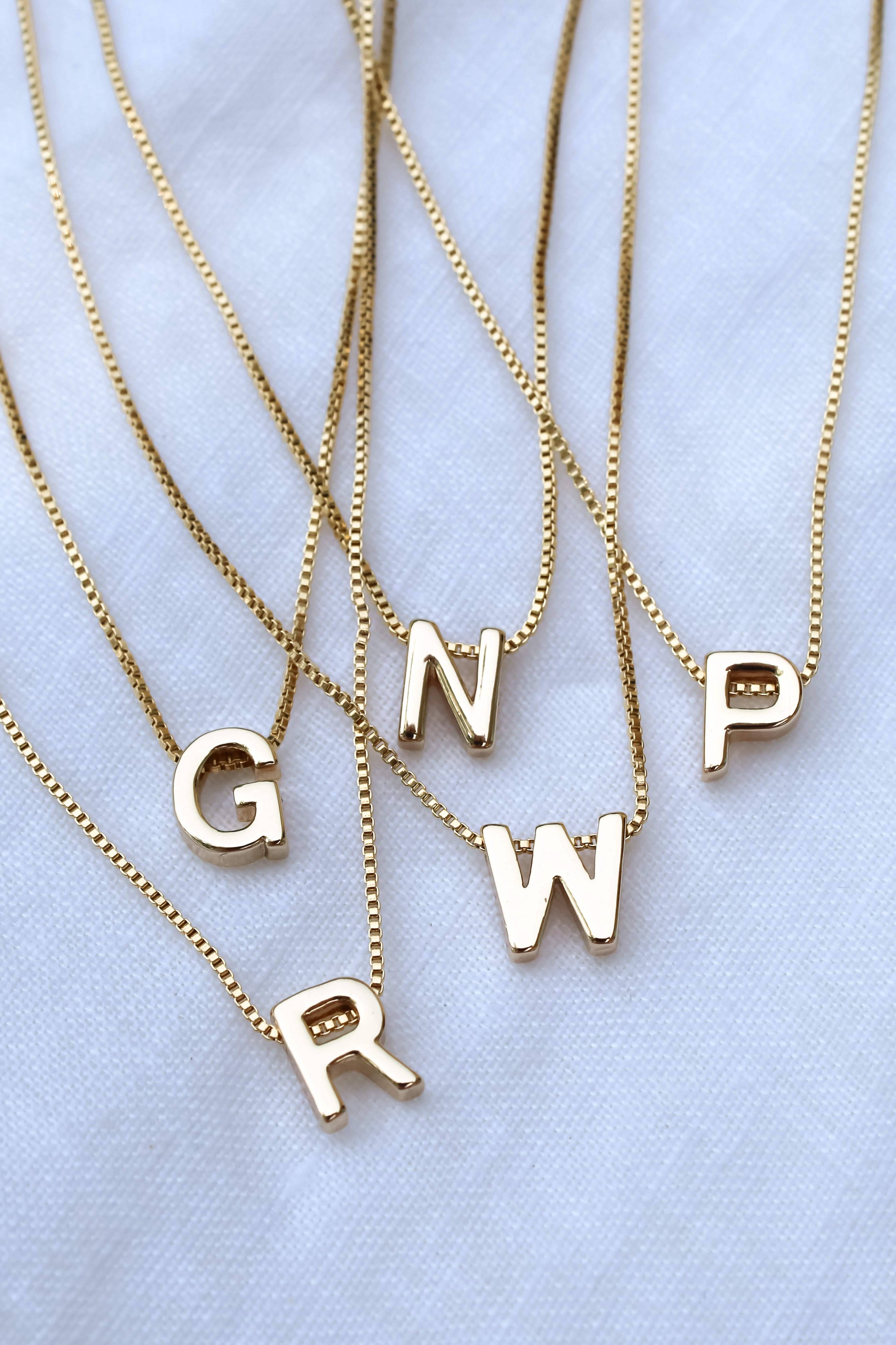 Designer alphabet necklace sales