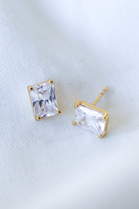 Prism Studs by Kinsey Designs, crafted from gold filled metal and embellished with sparkling cubic zirconia, shown on a soft white fabric background.
