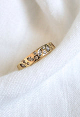 The Luna Ring - Multi by Kinsey Designs Archives, featuring gold plating with leaf and diamond details in size 7, is displayed on soft white fabric.