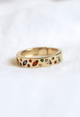 The Luna Ring - Multi by Kinsey Designs Archives features colorful gemstones in an irregular gold-plated setting. Displayed on a white background, it's available in size 7—perfect for adding a vibrant touch to your style.