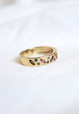 The Kinsey Designs Archives Luna Ring - Multi, a gold-plated size 7 ring with multicolored gemstones in varied shapes, rests elegantly on white fabric—an ideal sample sale find.